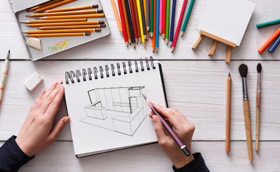 Draw in sketchbook. Creative artist workspace top view. Background of painting, art stationery